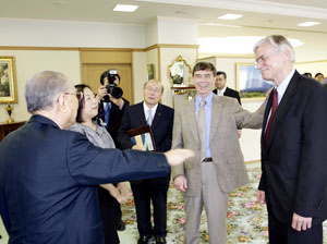 Mr. Ikeda converses with Professors Garrison  and Hickman